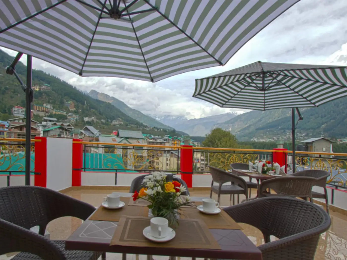 Outdoor dining terrace with mountain views at a hotel.